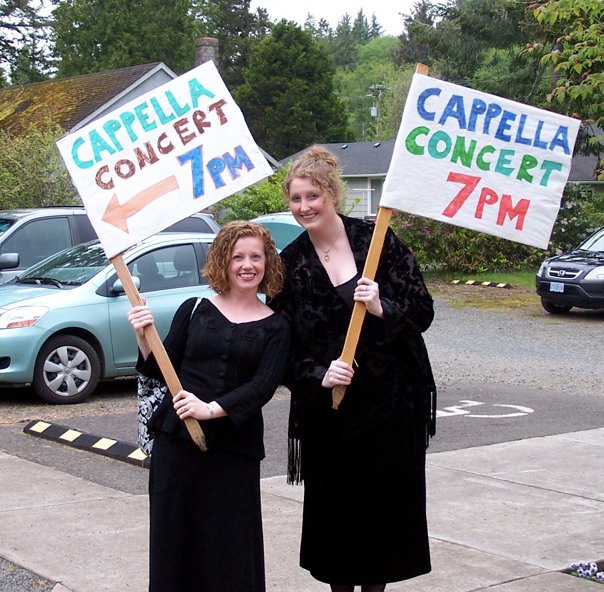 Oregon Coast Tour 2010 mentioned above (Catherine and Kristen with signs that say Cappella Concert 7pm)